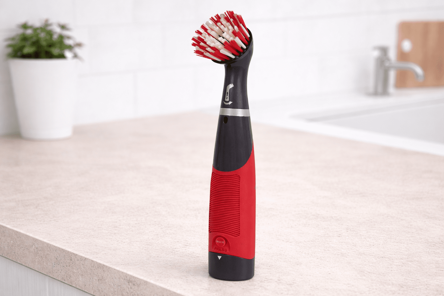 Rubbermaid Reveal power scrubber on bathroom surface